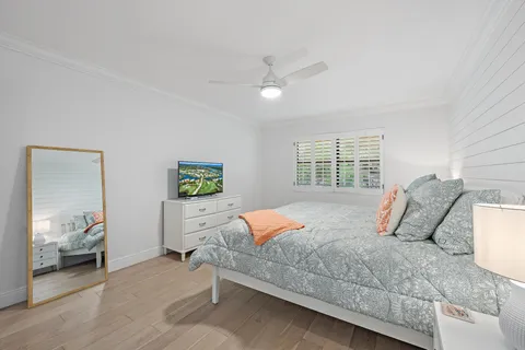 a bedroom with a bed and window