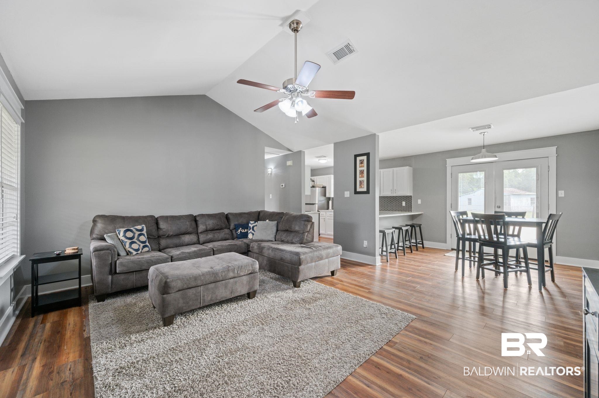 1107 North Oak Street Loxley, AL 36551 - Photo 3 of 40 Living room with dark hardwood / wood-style flooring, ceiling fan, and lofted ceiling