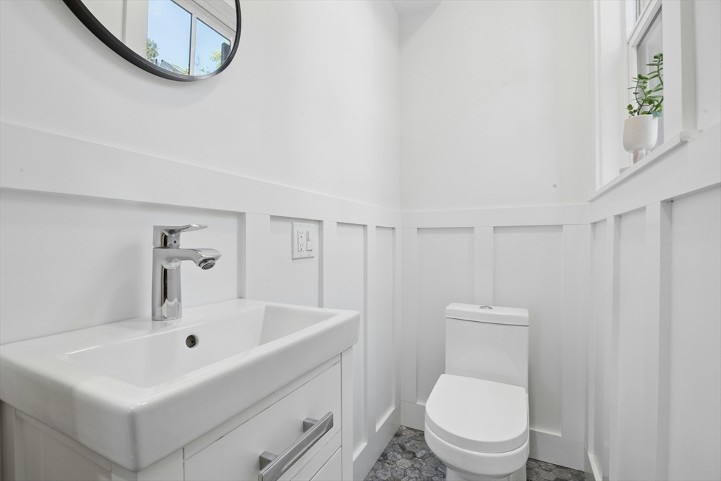 90 Florian Street Boston, MA 02130 - Photo 11 of 32 a white toilet sitting next to a bathroom sink