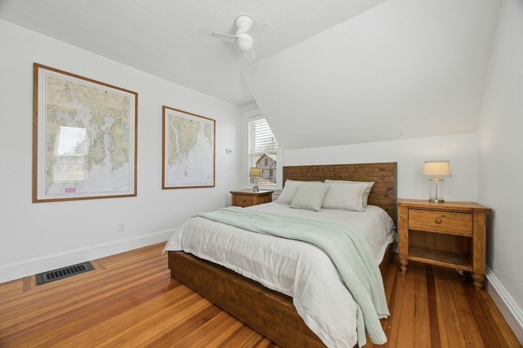 90 Florian Street Boston, MA 02130 - Photo 17 of 32 a bedroom with a bed and a painting on the wall