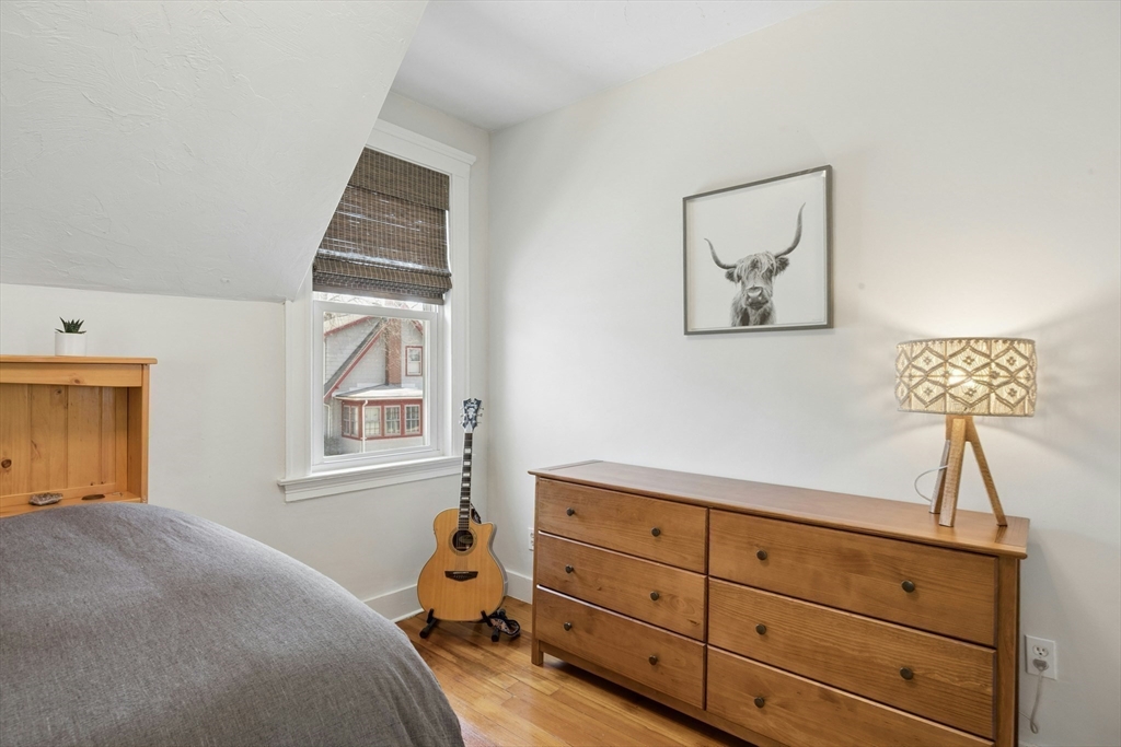 90 Florian Street Boston, MA 02130 - Photo 22 of 32 a bedroom with a bed and a window