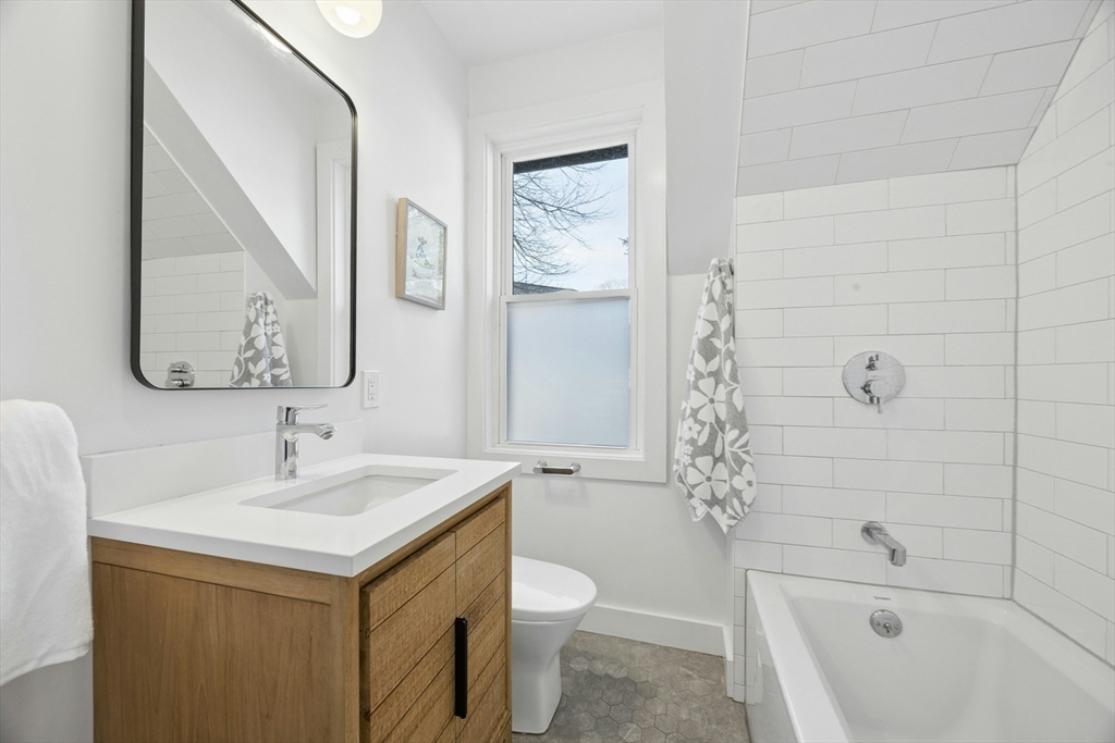 90 Florian Street Boston, MA 02130 - Photo 24 of 32 a bathroom with a sink a toilet and shower