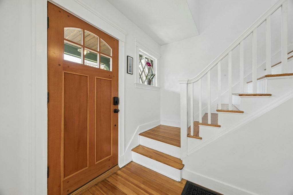 90 Florian Street Boston, MA 02130 - Photo 3 of 32 a view of entryway with wooden floor and stairs