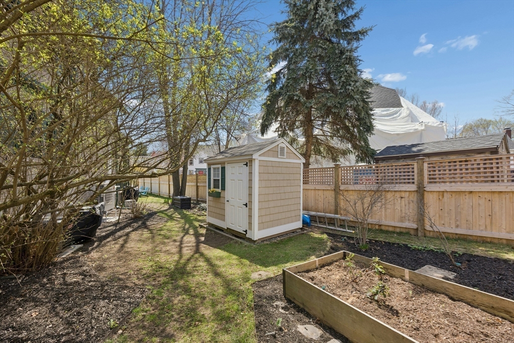 90 Florian Street Boston, MA 02130 - Photo 32 of 32 a view of a backyard with wooden fence