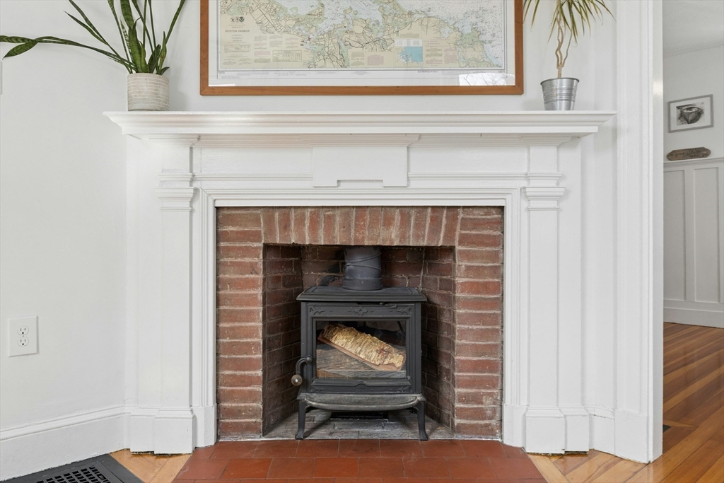 90 Florian Street Boston, MA 02130 - Photo 6 of 32 a living room with a fireplace and a potted plant