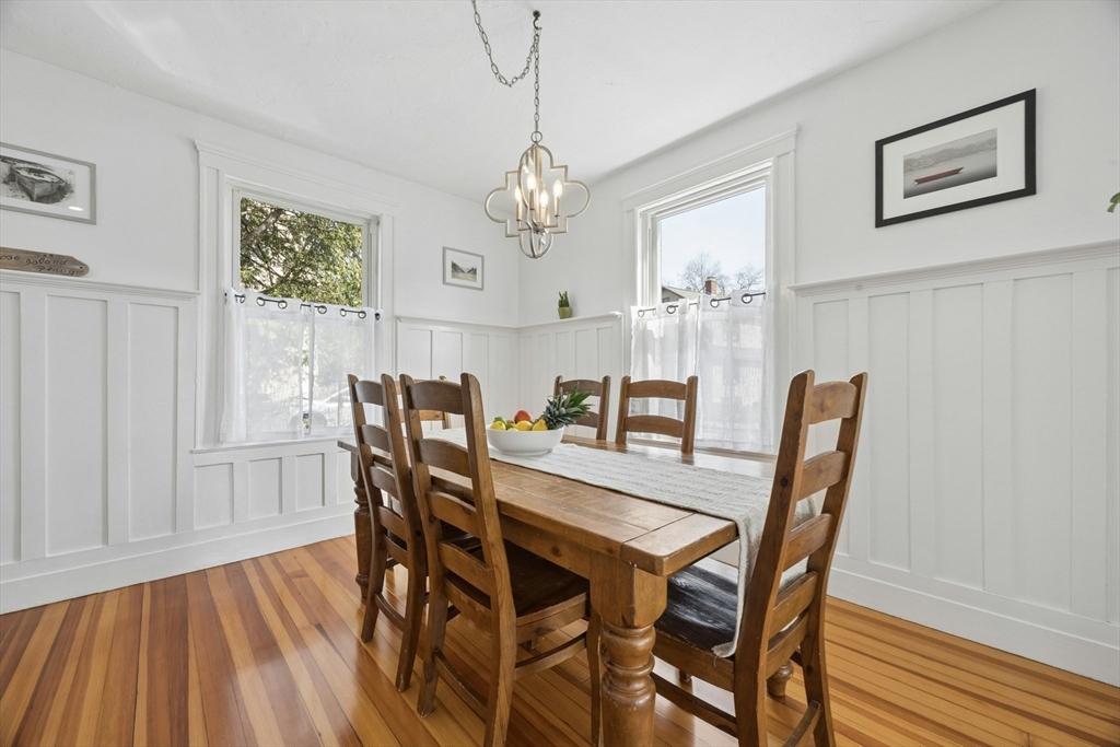 90 Florian Street Boston, MA 02130 - Photo 8 of 32 a view of a dining room with furniture window and wooden floor