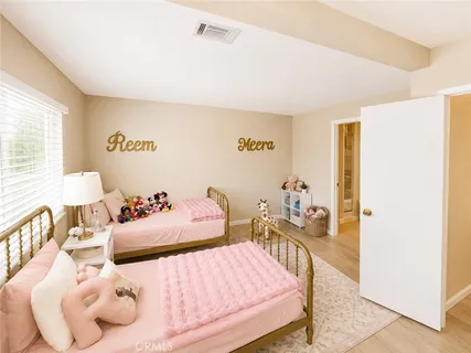 a bedroom with bed and a window