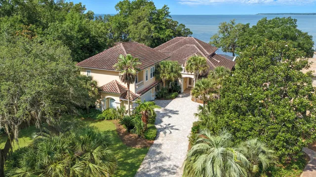 a view of a house with a yard and plants
