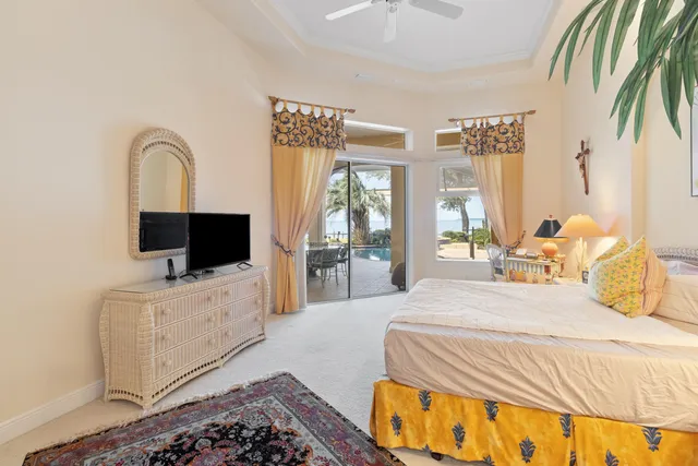 a bedroom with bed and a potted plant