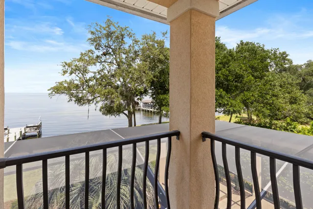 a bedroom with furniture and a potted plant