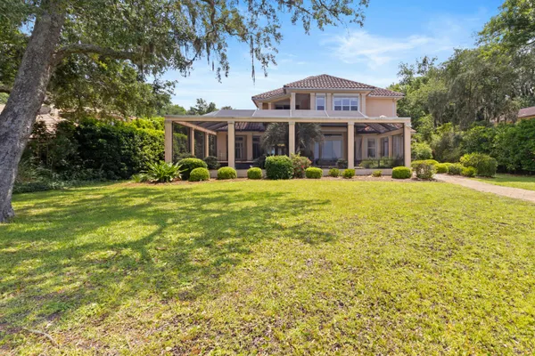 a view of an ocean and trees
