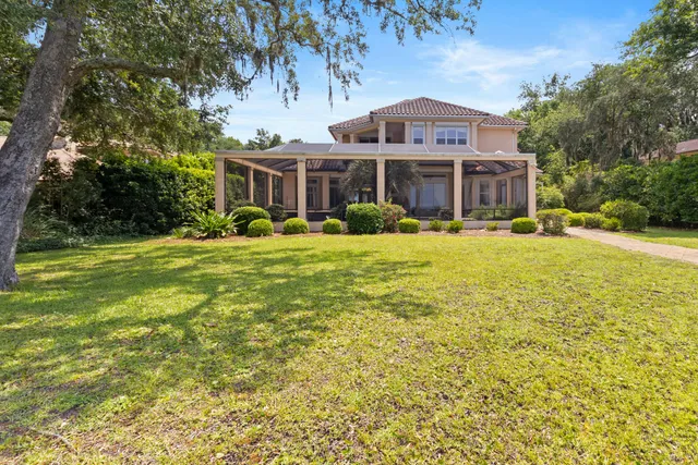 a view of an ocean and trees