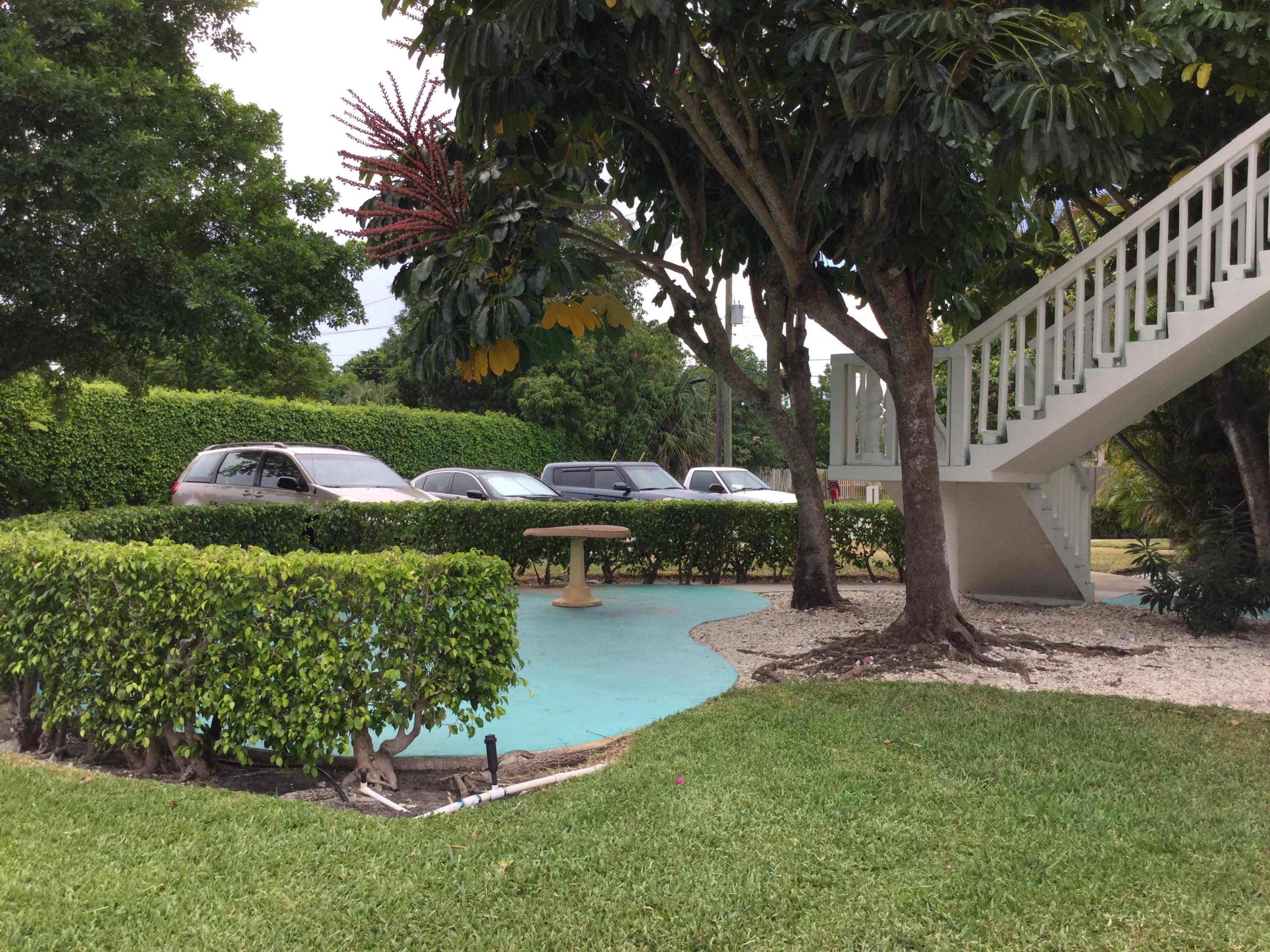 316 Southeast 1st Street, Unit 4 Boynton Beach, FL 33435 - Photo 11 of 16 a view of a garden with an outdoor space