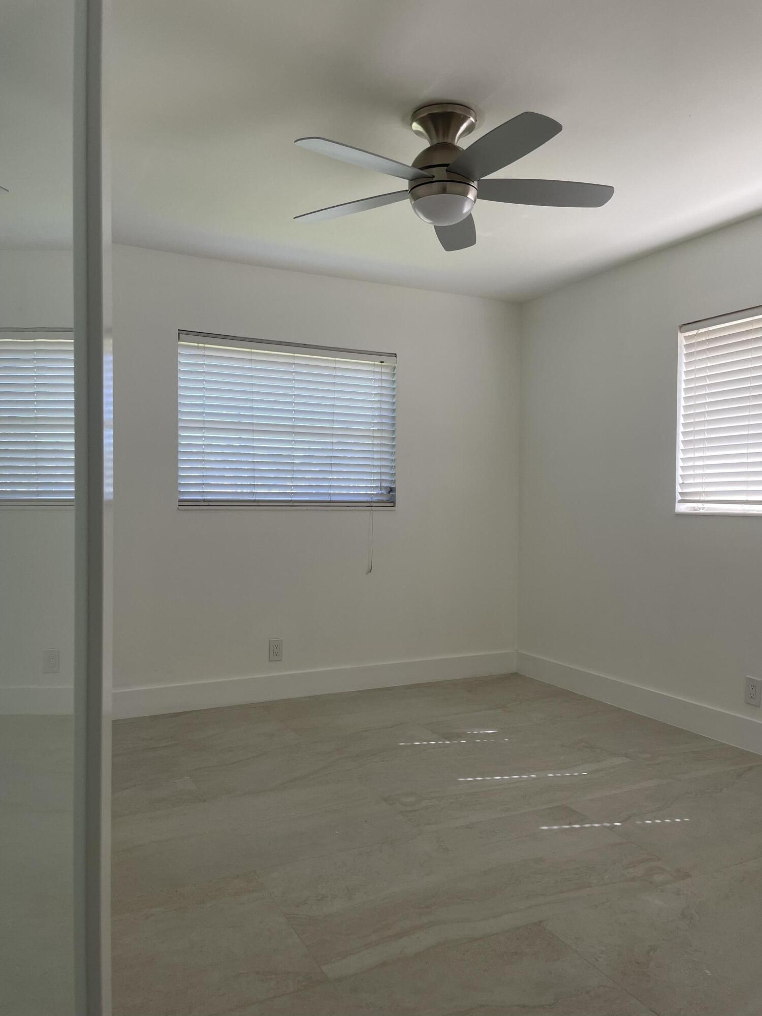 316 Southeast 1st Street, Unit 4 Boynton Beach, FL 33435 - Photo 7 of 16 en empty room with window