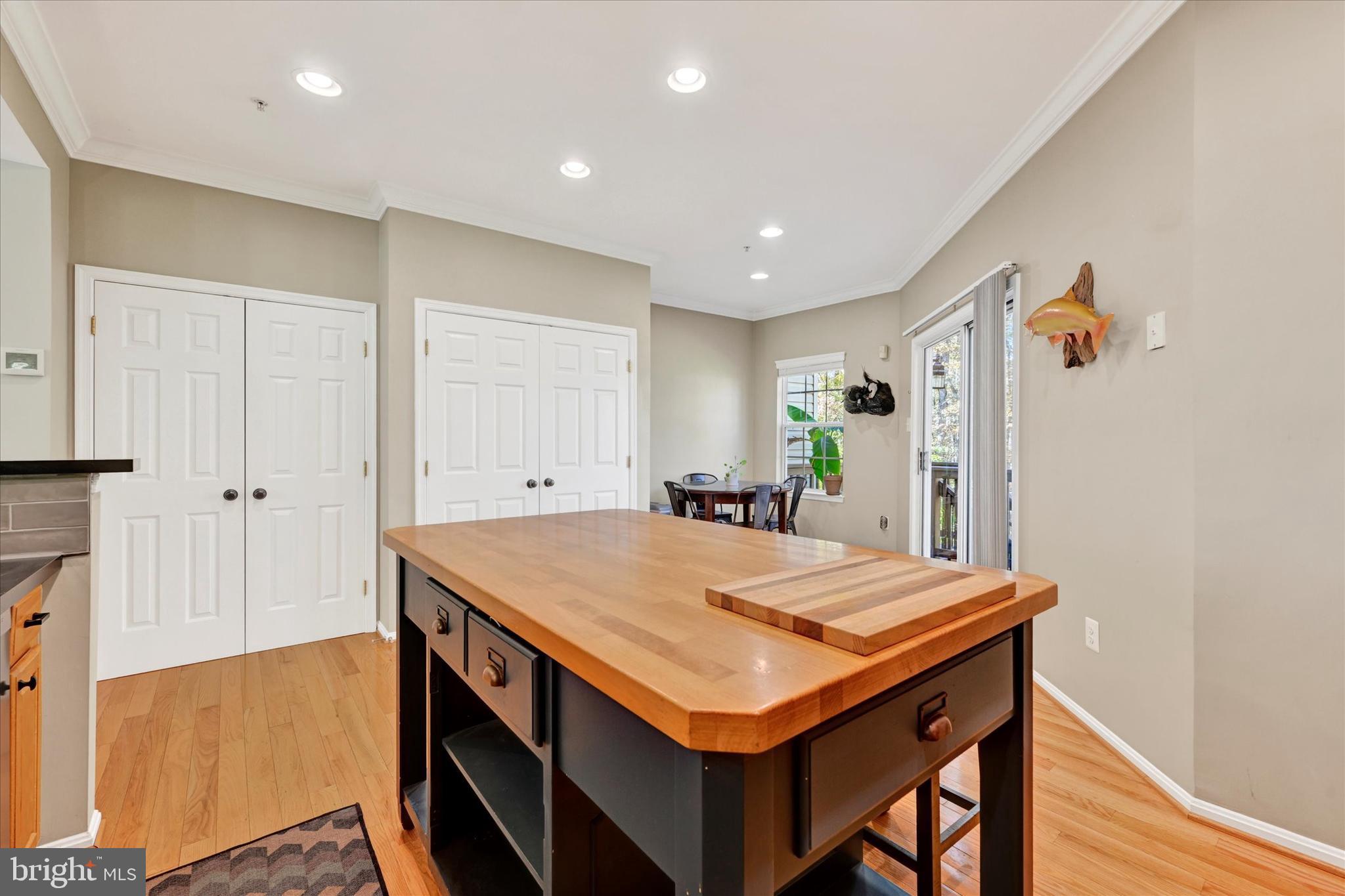 2370 Sandy Walk Way Odenton, MD 21113 - Photo 15 of 33 a kitchen that has a table and chairs in it