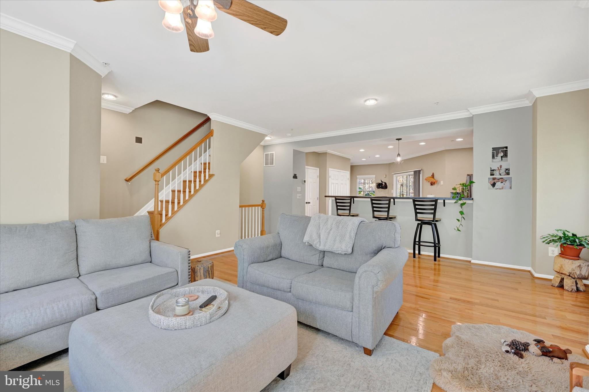 2370 Sandy Walk Way Odenton, MD 21113 - Photo 19 of 33 a living room with furniture and a dining table