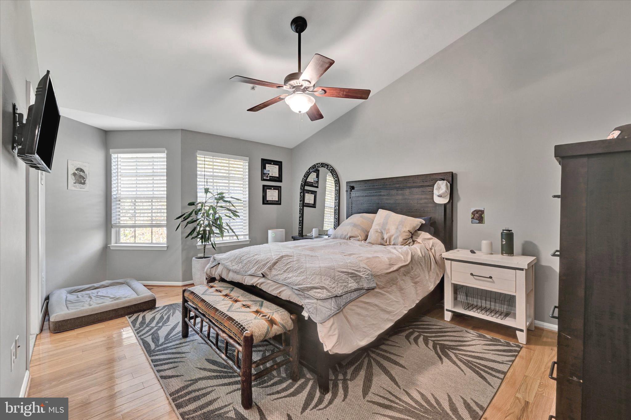 2370 Sandy Walk Way Odenton, MD 21113 - Photo 23 of 33 a bedroom with a bed and a chandelier