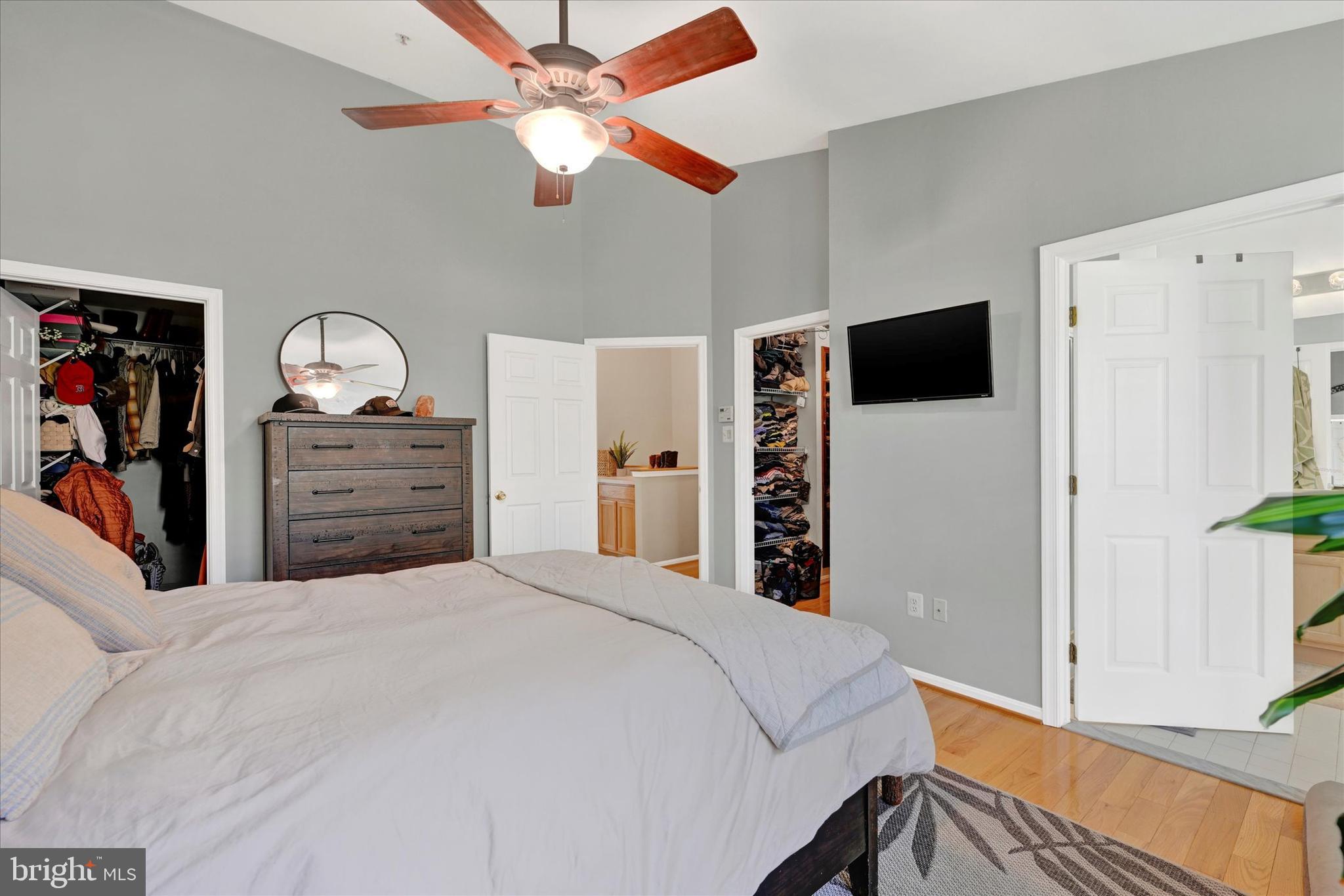 2370 Sandy Walk Way Odenton, MD 21113 - Photo 24 of 33 a bedroom with a bed and a flat tv screen on dresser