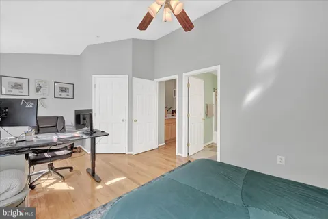 a workspace with a table and a potted plant