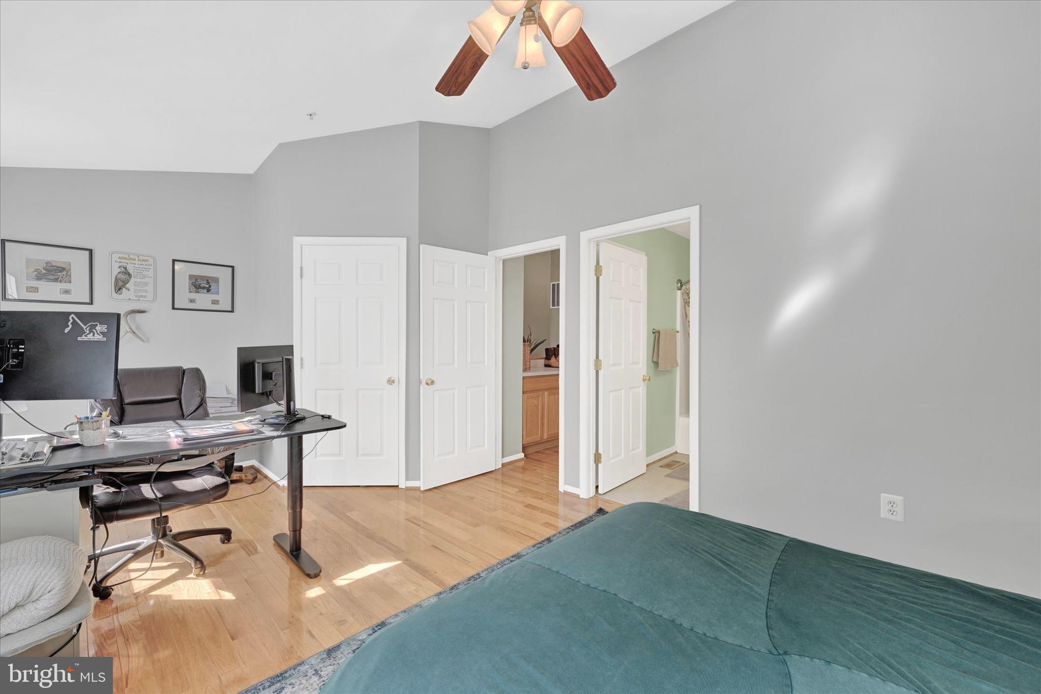 2370 Sandy Walk Way Odenton, MD 21113 - Photo 27 of 33 a workspace with a table and a potted plant