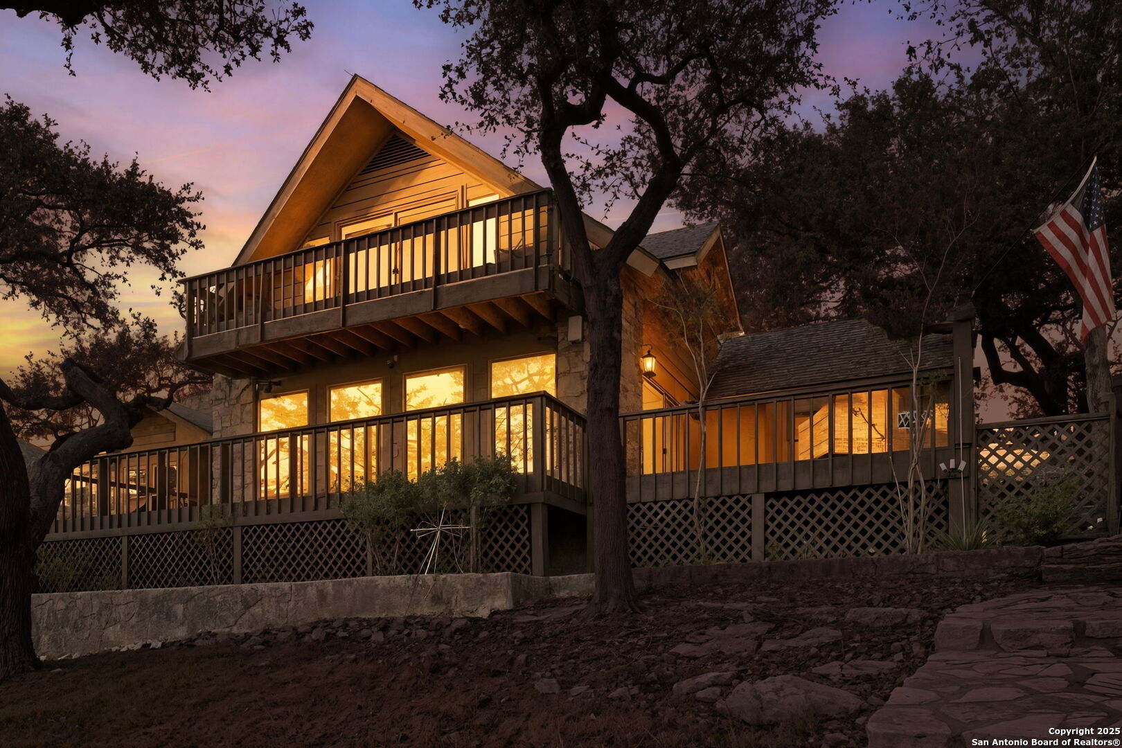 a view of wooden house with a yard