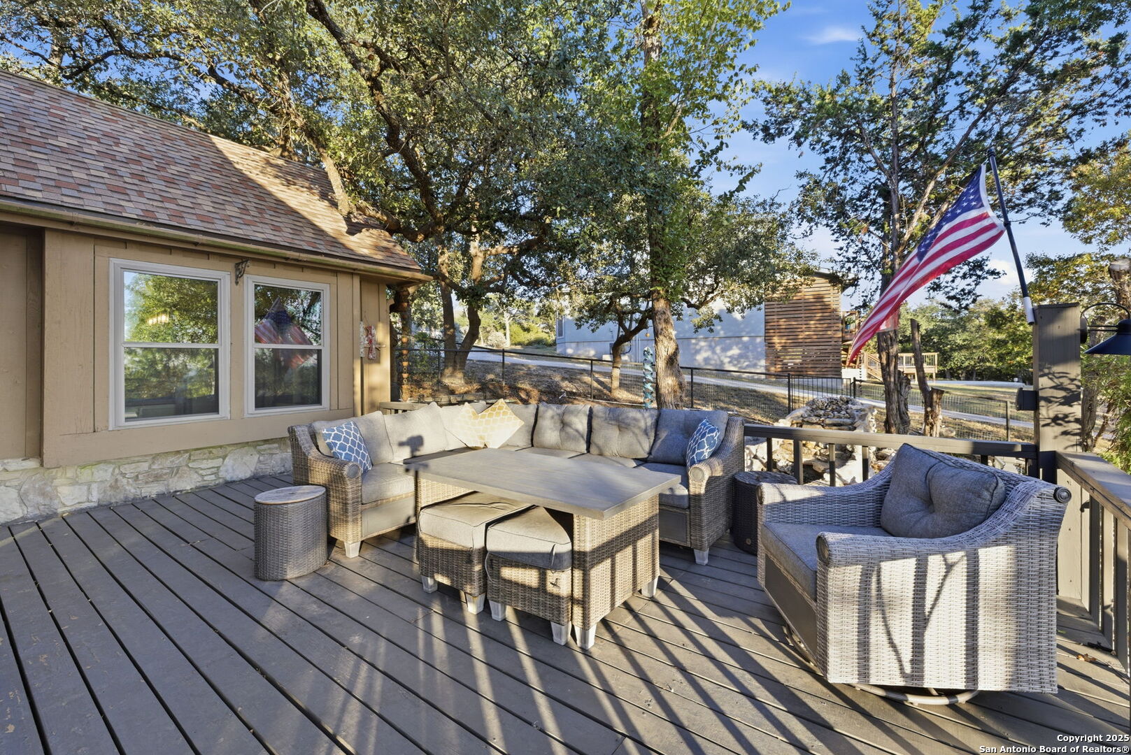 1072 Summit Canyon Lake, TX 78133 - Photo 14 of 50 a view of a patio with table and chairs and wooden floor