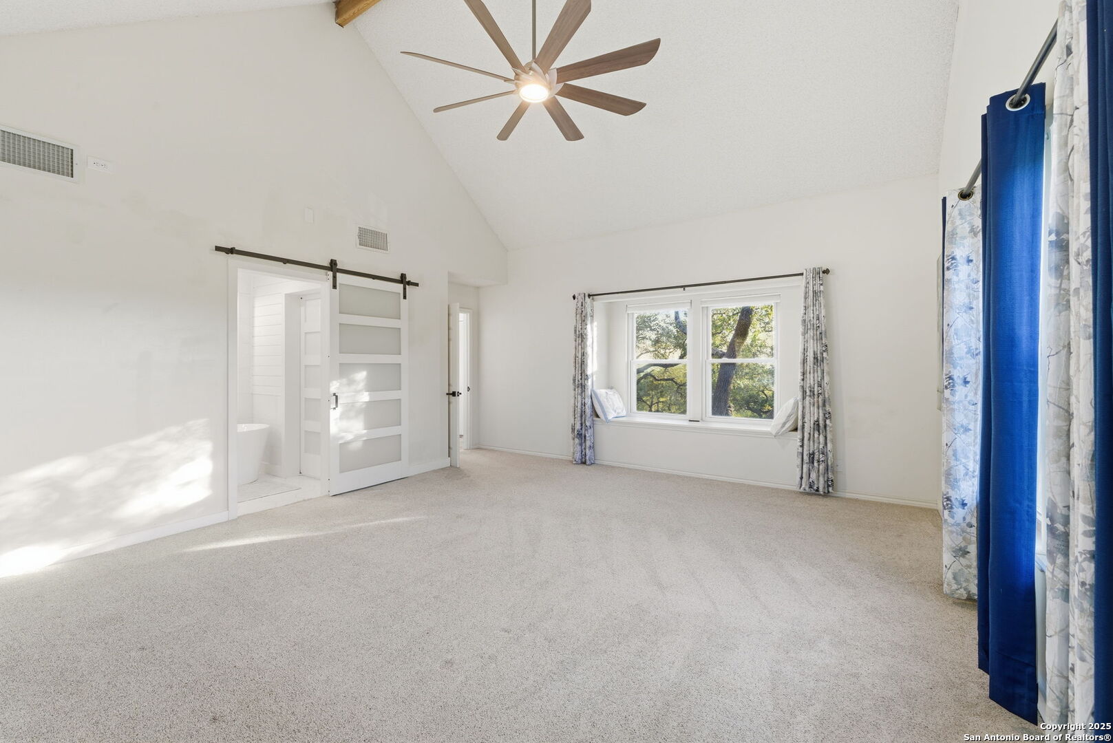 1072 Summit Canyon Lake, TX 78133 - Photo 21 of 50 a view of a big room with chandelier fan and windows