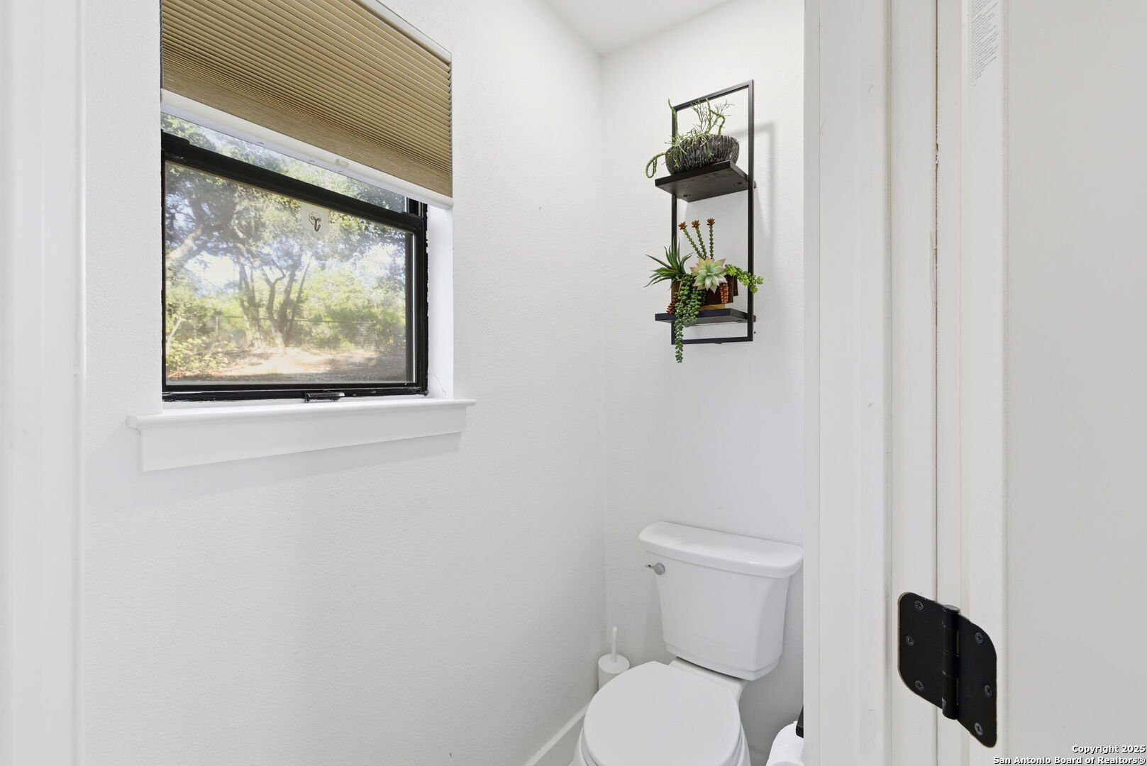 1072 Summit Canyon Lake, TX 78133 - Photo 28 of 50 a white toilet sitting next to a small window
