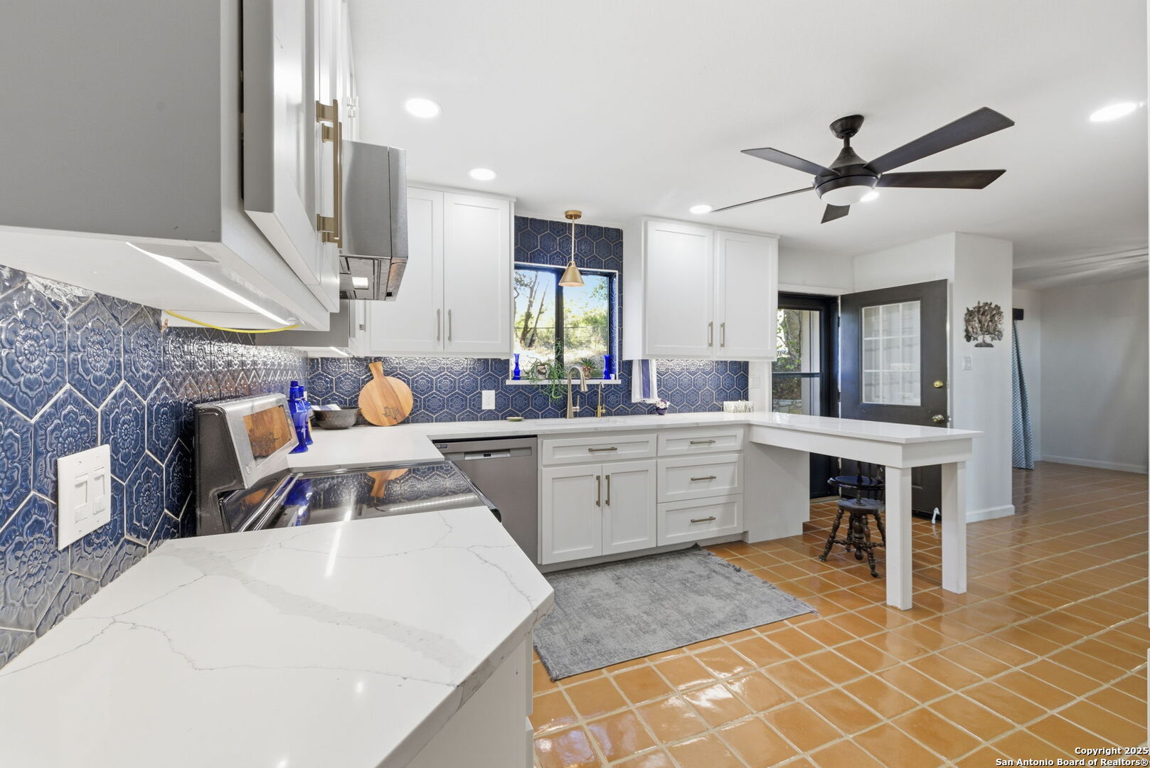 1072 Summit Canyon Lake, TX 78133 - Photo 30 of 50 a large white kitchen with a large window