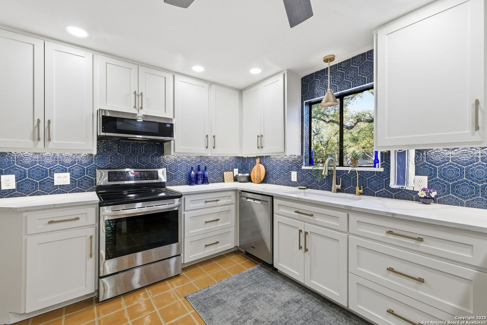 1072 Summit Canyon Lake, TX 78133 - Photo 31 of 50 a kitchen with white cabinets and appliances