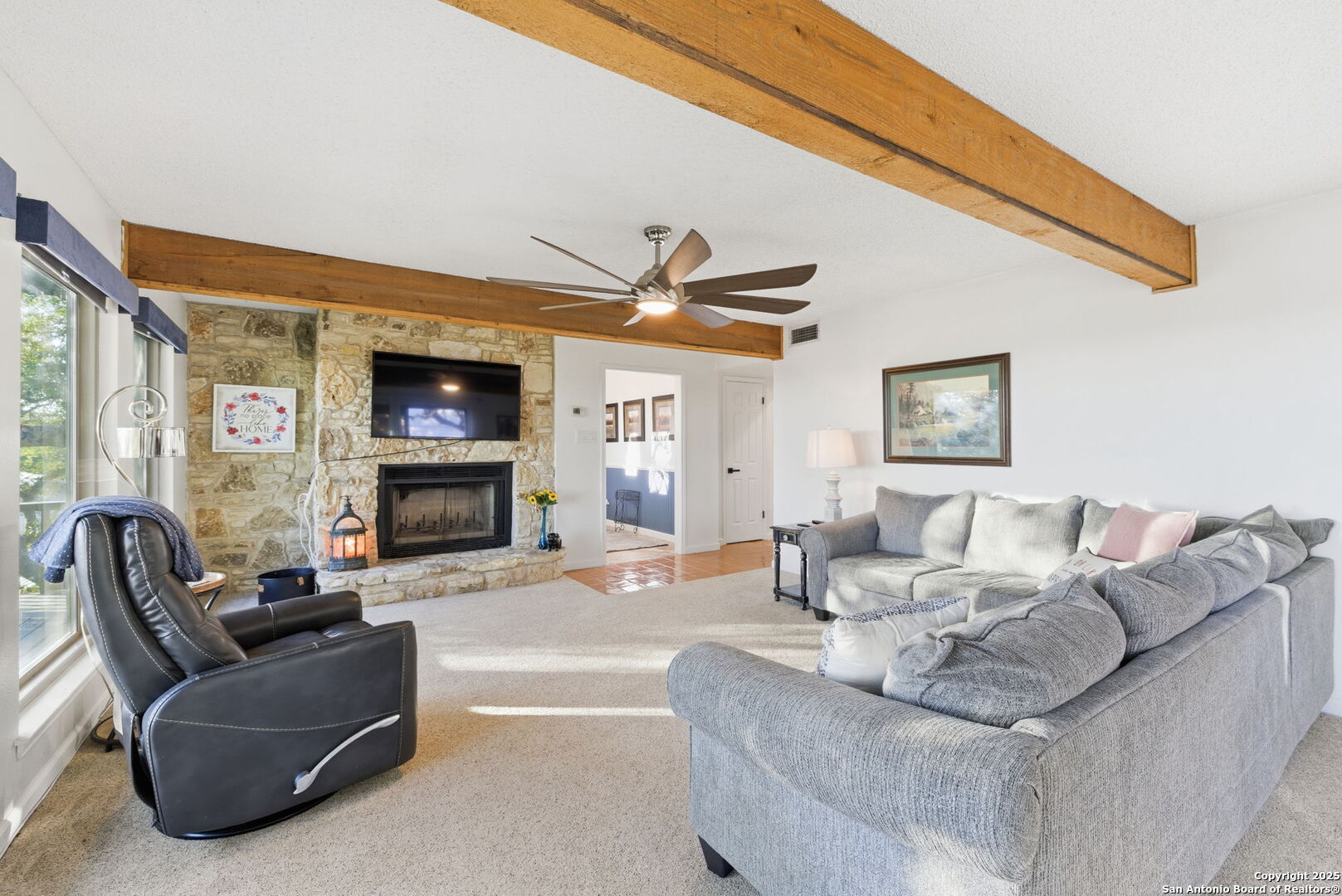 1072 Summit Canyon Lake, TX 78133 - Photo 37 of 50 a living room with furniture a fireplace and a flat screen tv