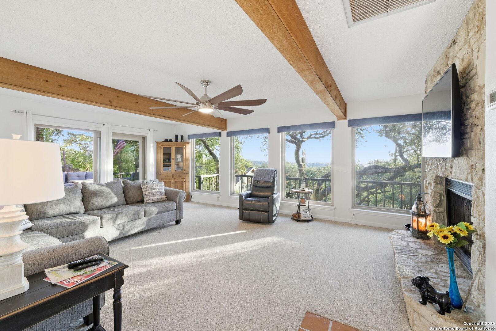 1072 Summit Canyon Lake, TX 78133 - Photo 40 of 50 a living room with furniture and a floor to ceiling window