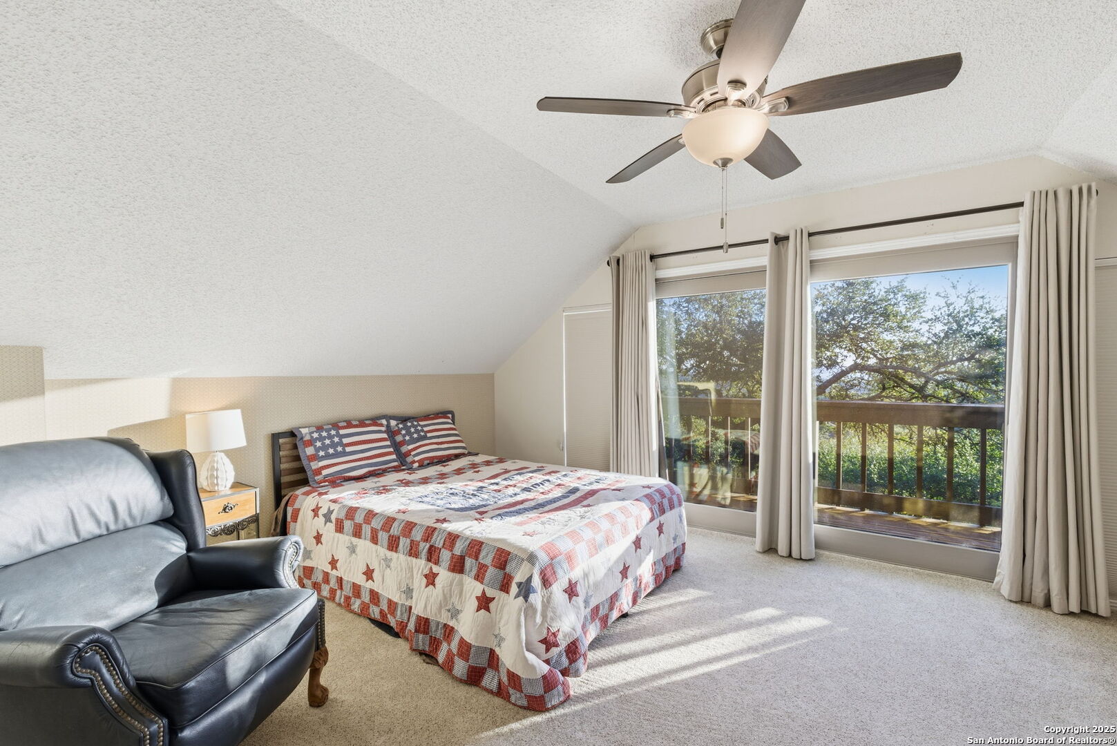 1072 Summit Canyon Lake, TX 78133 - Photo 41 of 50 a bedroom with a bed couch and window