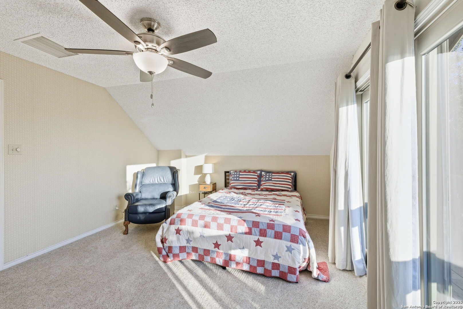 1072 Summit Canyon Lake, TX 78133 - Photo 42 of 50 a bedroom with two beds and a chandelier