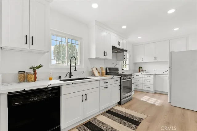 a kitchen with a sink and cabinets