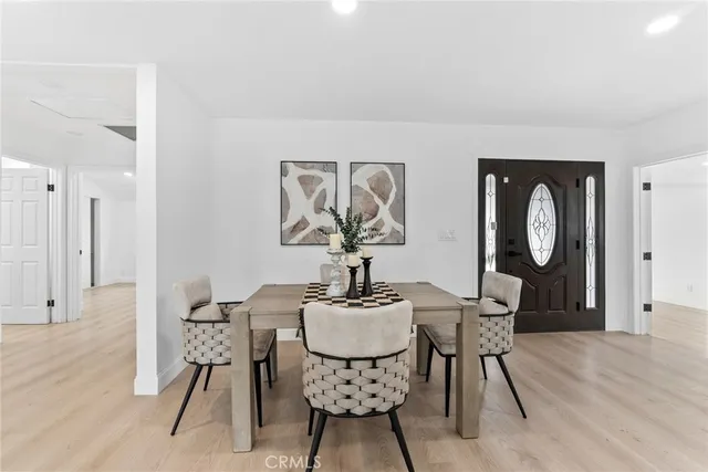 a bedroom with furniture and a wooden floor