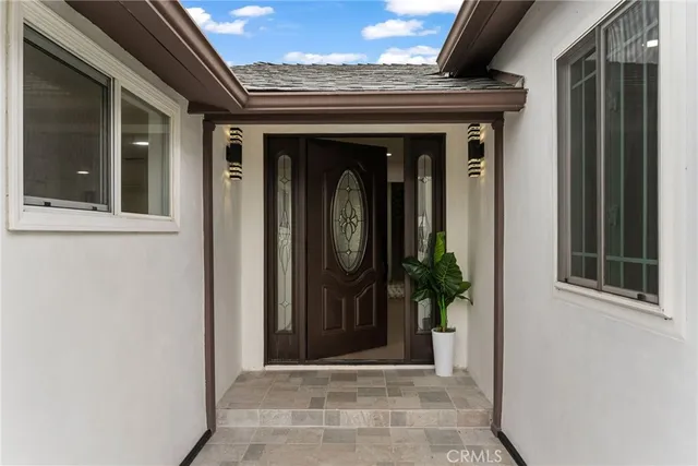 a view of a entryway door front of a house