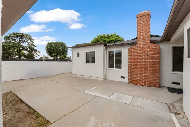 a view of a chairs and table in patio