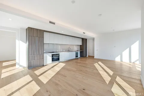a view of livingroom with kitchen and window
