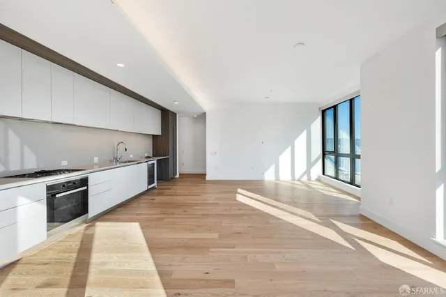 a view of a kitchen with a sink and dishwasher