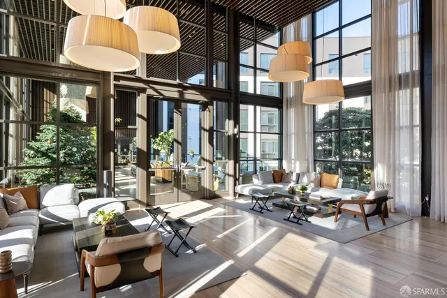 a building outdoor space with patio furniture and potted plants