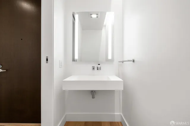 a bathroom with a sink and a mirror