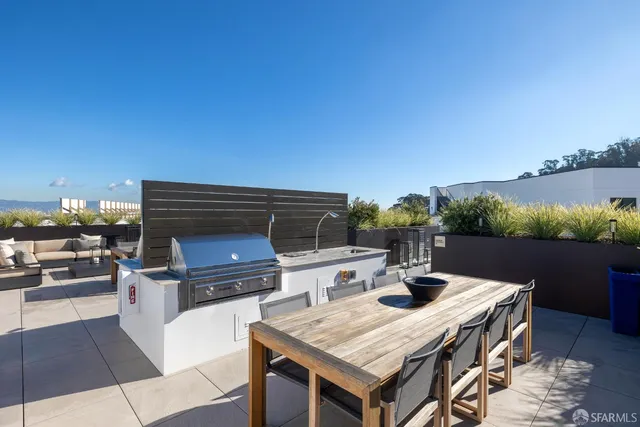 a view of an outside dining space with furniture