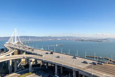 a view of a balcony with two chairs