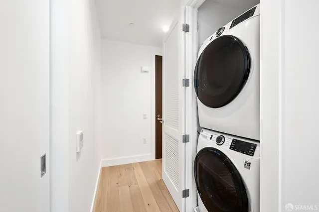 a view of a hallway with washer and dryer