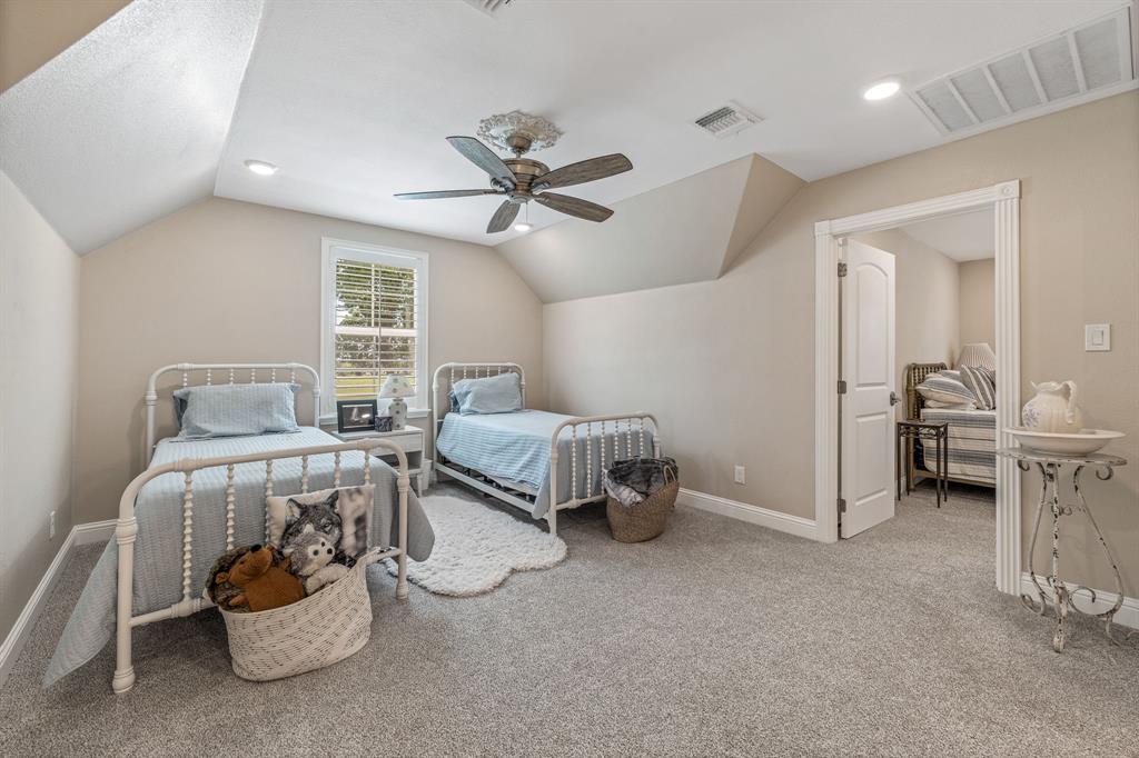 1340 County Road 189 Jonesboro, TX 76538 - Photo 19 of 39 a bedroom with a bed and a chandelier