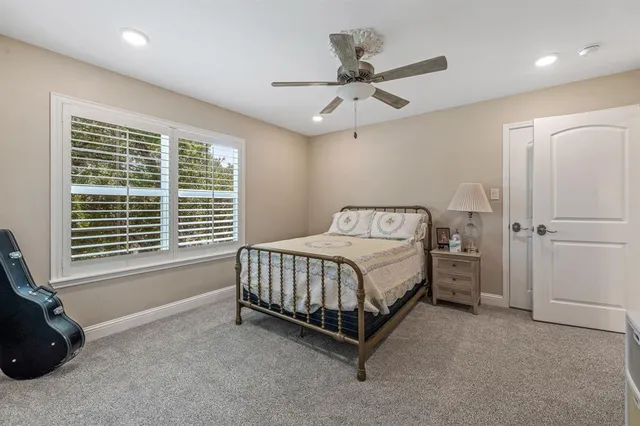 a bed sitting in a room next to a window