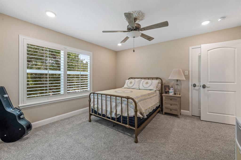 1340 County Road 189 Jonesboro, TX 76538 - Photo 21 of 39 a bed sitting in a room next to a window