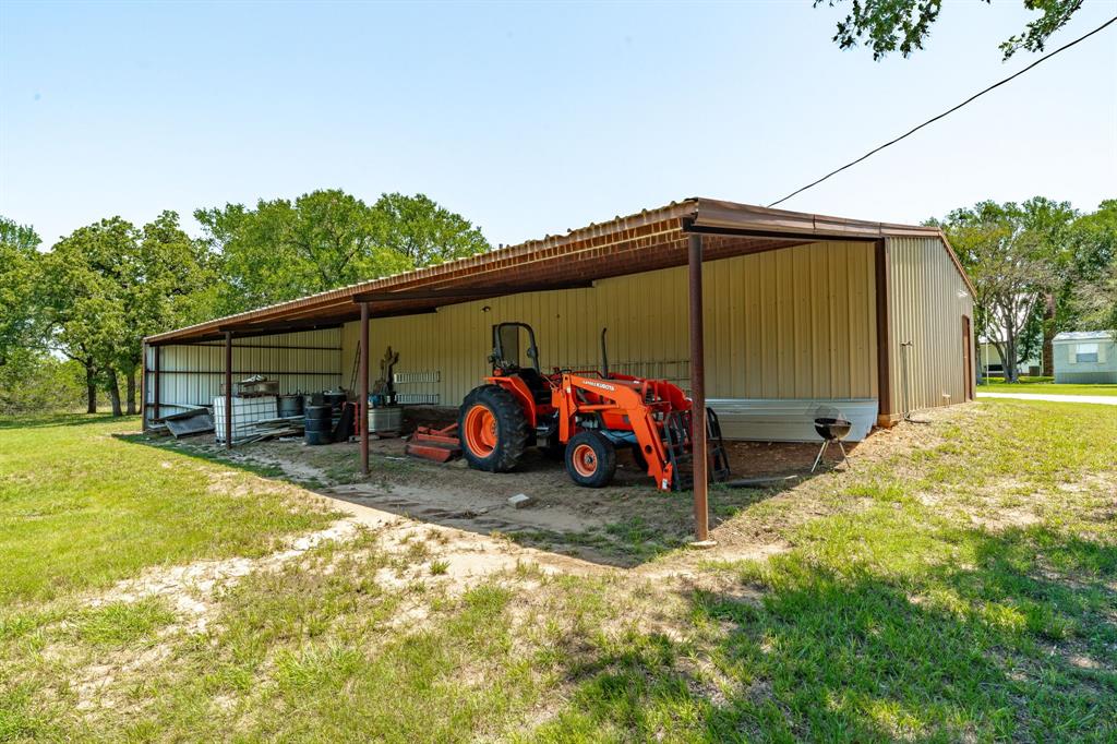 1340 County Road 189 Jonesboro, TX 76538 - Photo 26 of 39 a view of a house with a outdoor space