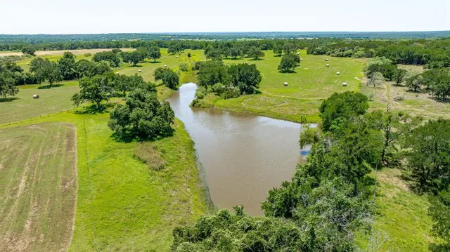 a view of a lake with a yard